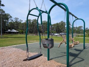 Mommy and Me swing on the playground at Empie Park.